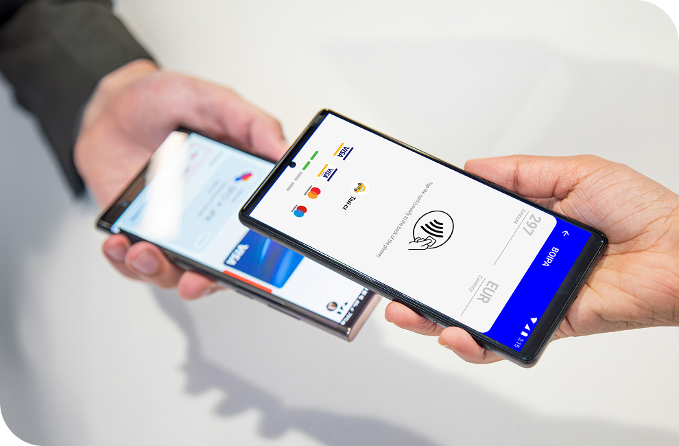 A customer uses Tap to Pay on Android to make a contactless payment phone to phone, using Genius mobile pay app.