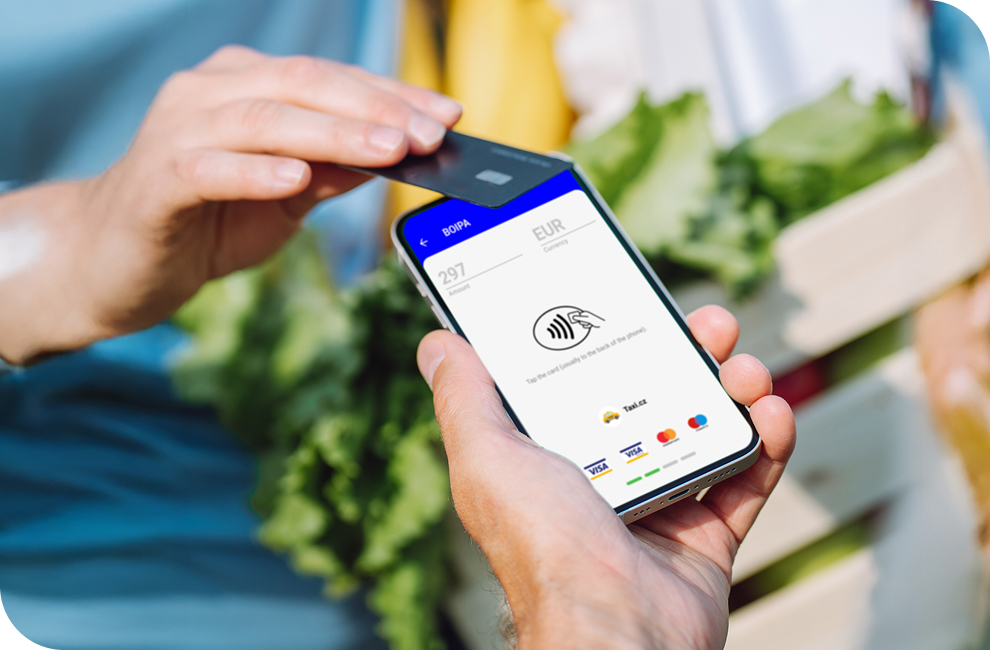 A customers taps a contactless card on an iPhone using Genius mobile pay app.