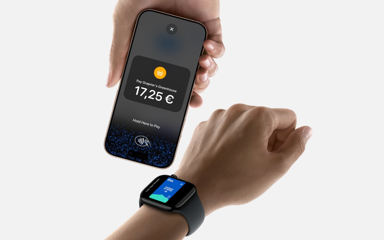 Person making contactless payment to iphone using smartwatch