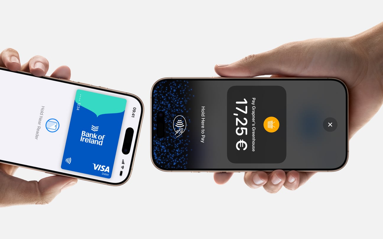 Close up of two iphones with one sending payment and the other receiving